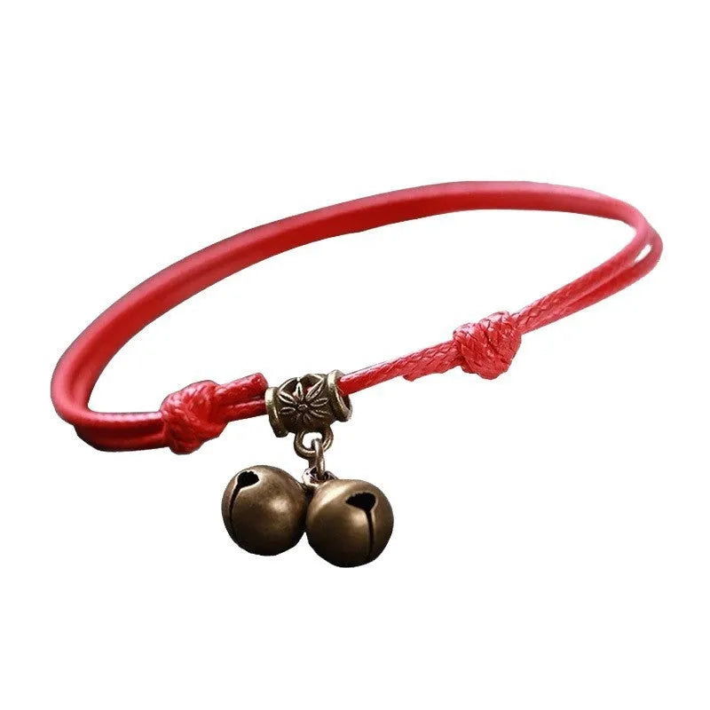 Nylon dog collar with brass bell shown in black rope colour, adjustable size 8 to 17 cm