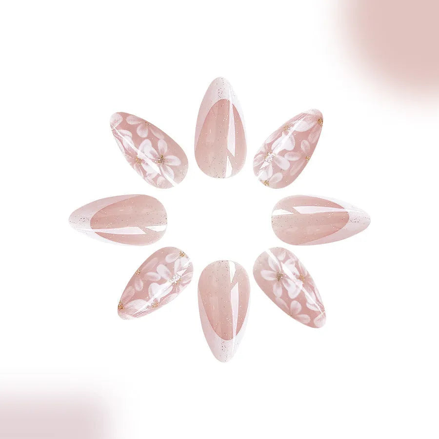 Removable short almond artificial nails with French style glitter flower design in colour C625