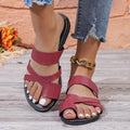 Solid colour hollow-out beach slippers with a rubber sole, shown in black, brown, and wine red.