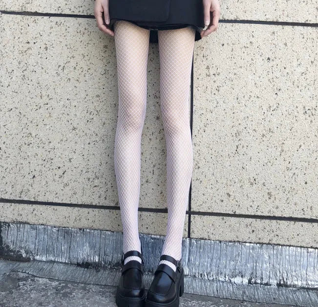 Women's thin mesh stockings in large, medium, and small net patterns in black and white.