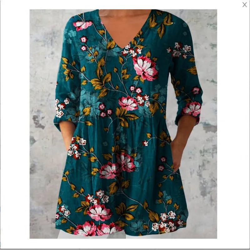 Women's loose-fitting printed dress with 3/4 sleeves and a wide waist design.