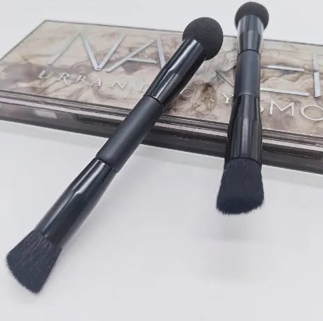 Double-headed makeup brush with miter sponge tip and artificial fibre bristles on wooden handle