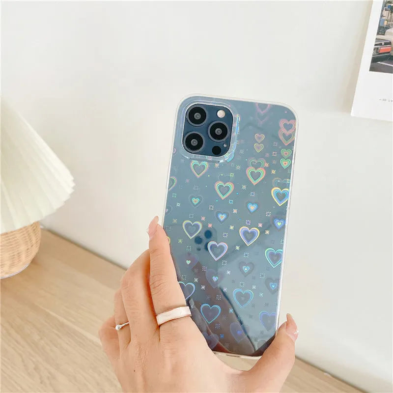 Translucent silicone iPhone case with a laser-etched love heart pattern on the back.