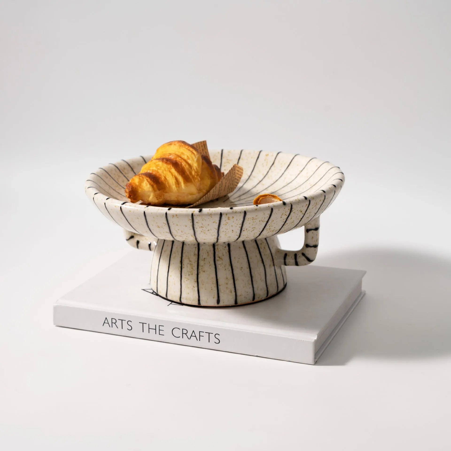 Black and white striped retro synthetic resin fruit plate ornament.