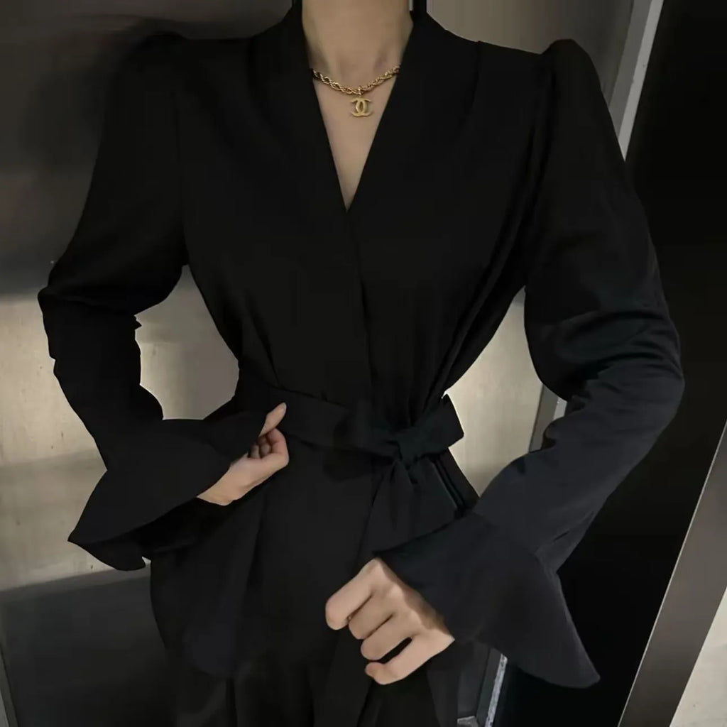 Women's black French-style shirt with irregular collar and long bell sleeves tied at waist