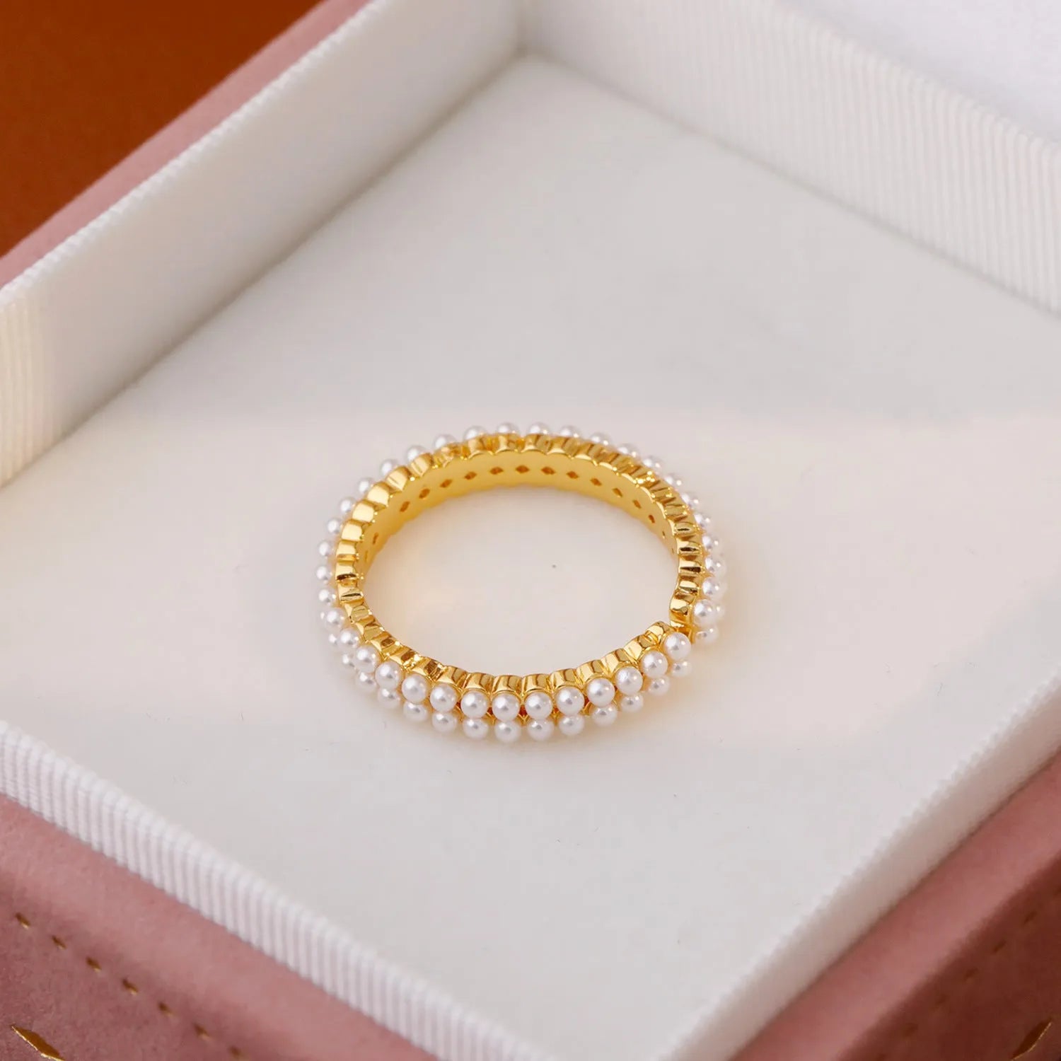 Geometric gold open mouth women's ring with round elements on female hand