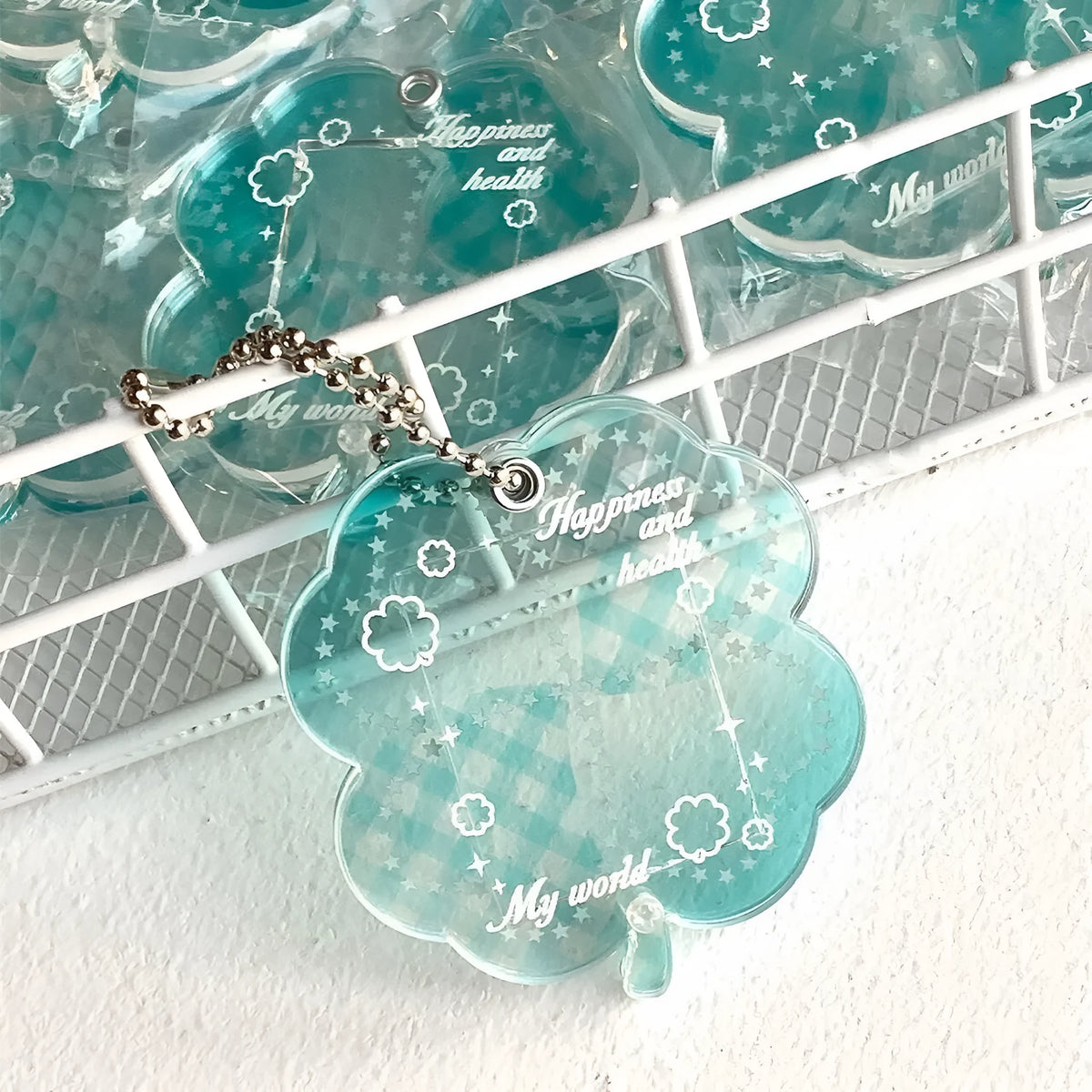 Acrylic four-leaf clover phone pendant in three colour variations