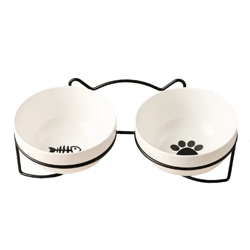 White ceramic cat bowl with decorative iron frame in cat footprints pattern