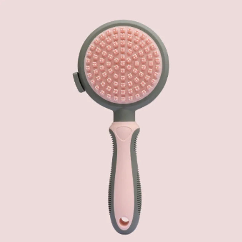 Green and pink two-sided silicone pet brush with slicker bristles and massage teeth on a white background