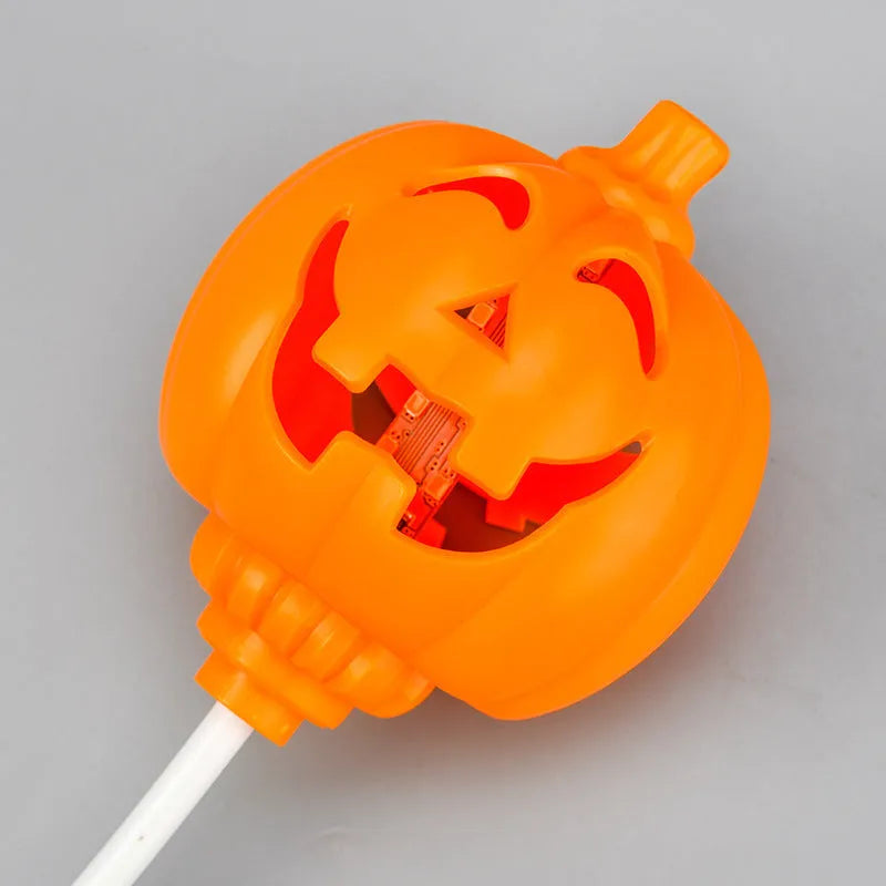 Plastic pumpkin lamp with yellow or purple light option, USB charging, 8.3cm wide by 22cm tall