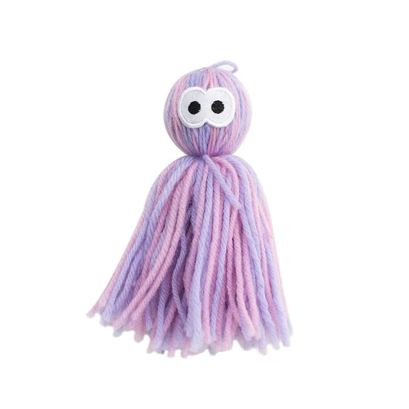 Set of four hanging wool ball cat toys with plastic teaser sticks in blue grey, pink and blue, and pink purple colours