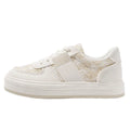 Beige platform sports board shoes with plaid pattern, rubber soles and lace-up front closure
