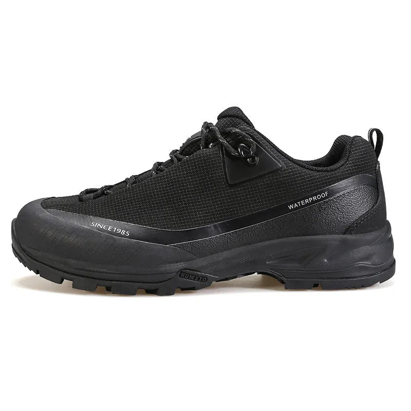 Men's low-top leather mesh hiking boots in black with non-slip rubber sole and lace-up front.