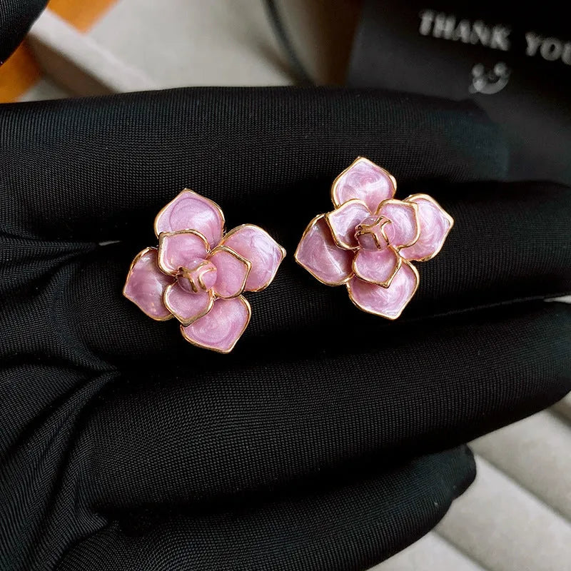 Golden-purple flower stud earrings with oil-spot glaze on copper
