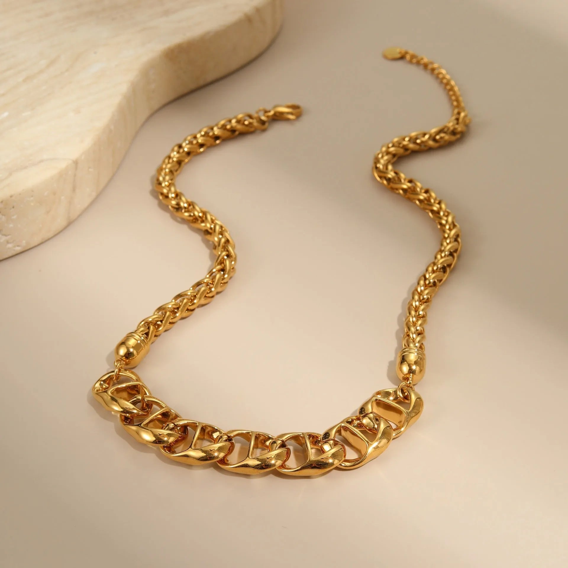 Gold plated stainless steel geometric pendant necklace for women on a chain.