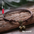 Nylon dog collar with brass bell shown in black rope colour, adjustable size 8 to 17 cm