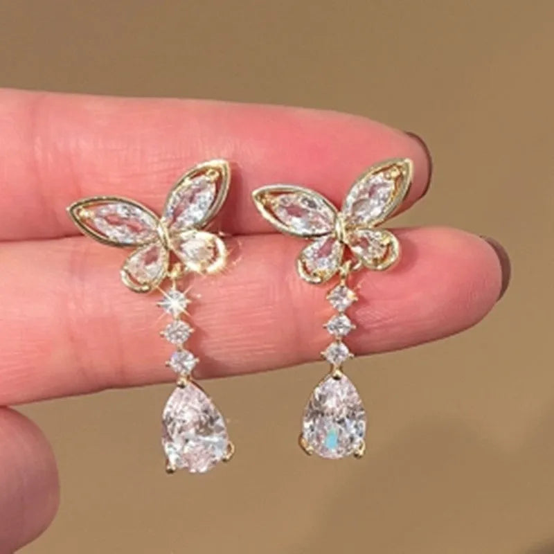 Women's platinum coloured bow stud earrings with electroplated finish on zinc alloy