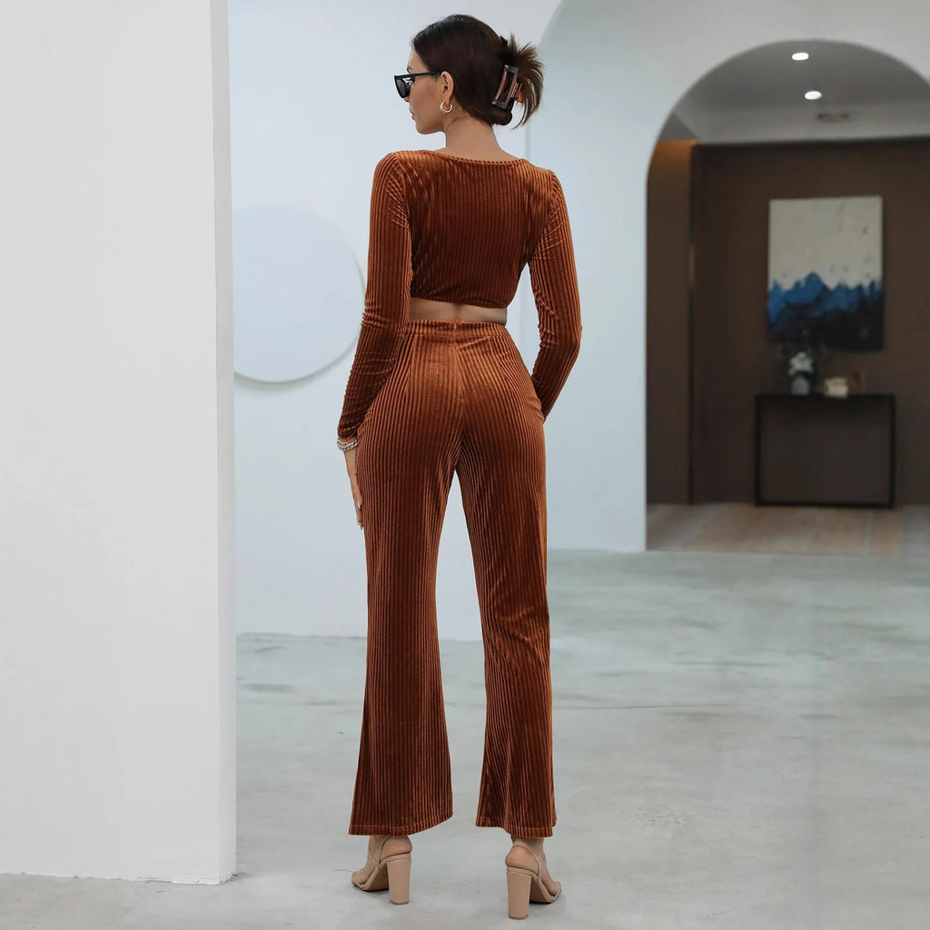 Caramel-colour long sleeve sweater and matching trousers casual set on a hanger.
