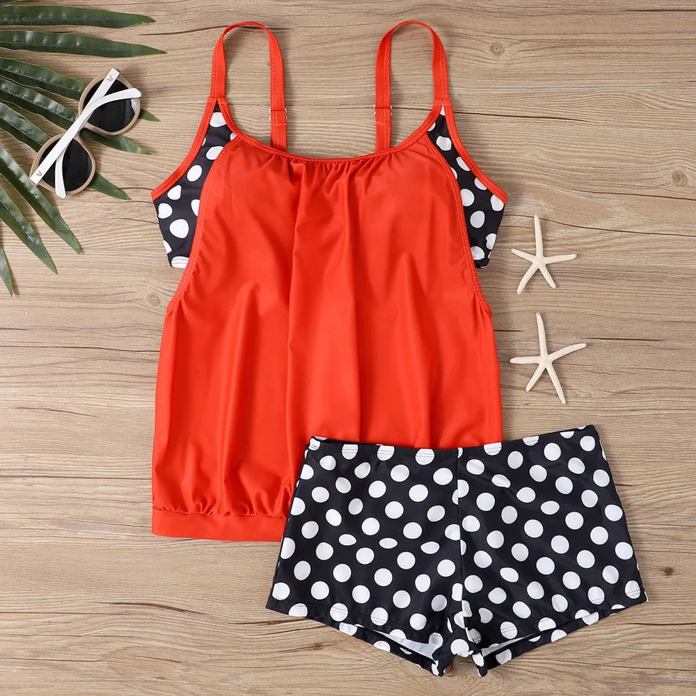 Women's black polka dot bikini set with a high-waisted boxer brief style.