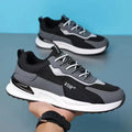 Men's colour block mesh sneakers in grey with lace-up closure and low-top design.