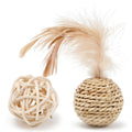 Two cat toys: a rattan ball with a bell and a faux feather ball on a plain background.