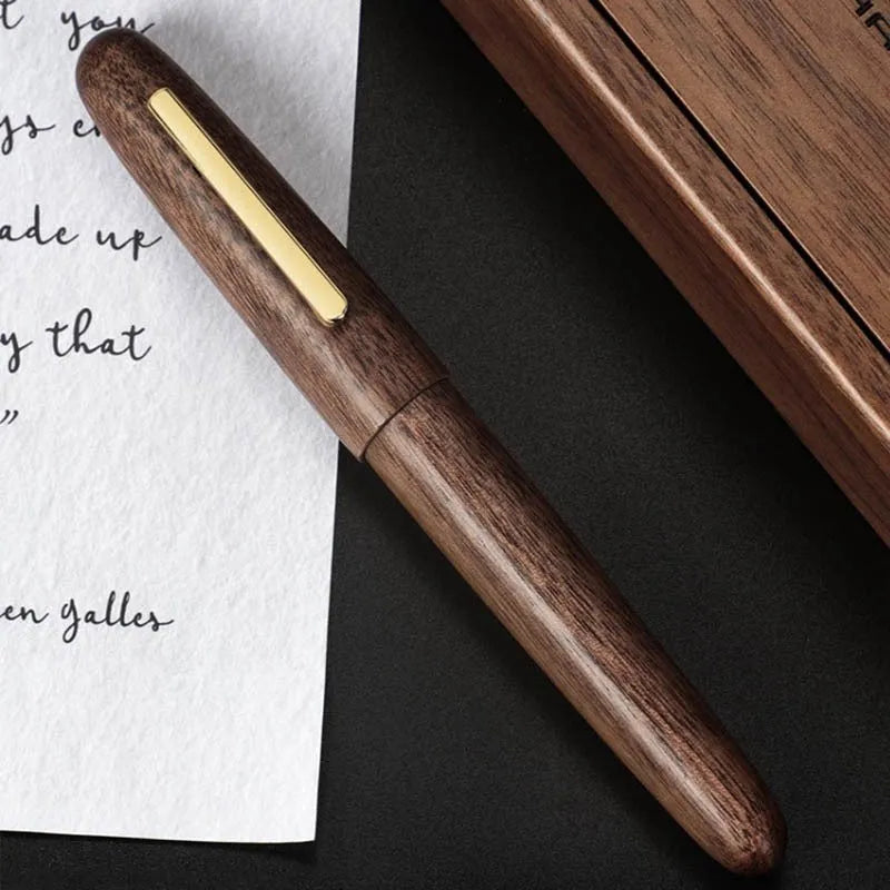 Wooden ballpoint pen with rotating cap showing alpine pear finish and straight tip