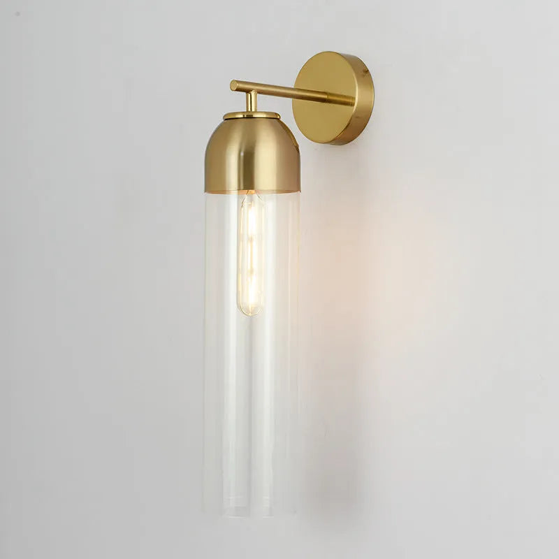 Nordic minimalist glass wall lamp in smoke grey colour mounted on a light wall.