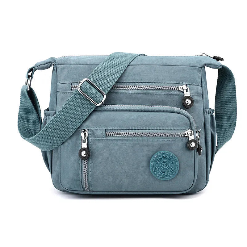 Soft nylon messenger bag with shoulder strap in square vertical shape