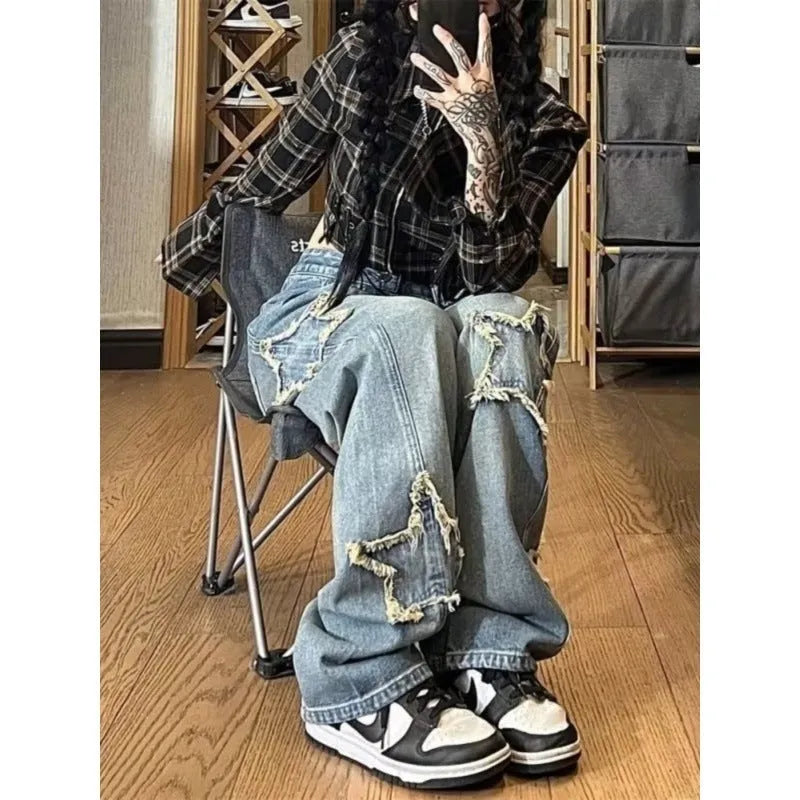 Blue women's high waist wide-leg denim jeans on a hanger, showing straight leg cut.