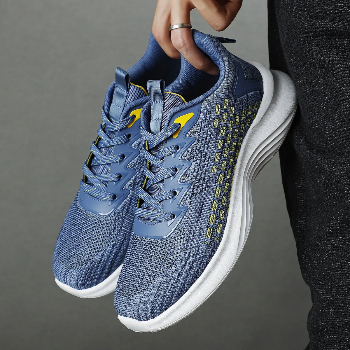 Women's lavender purple and blue Flyknit running shoes with mesh lining and striped pattern.