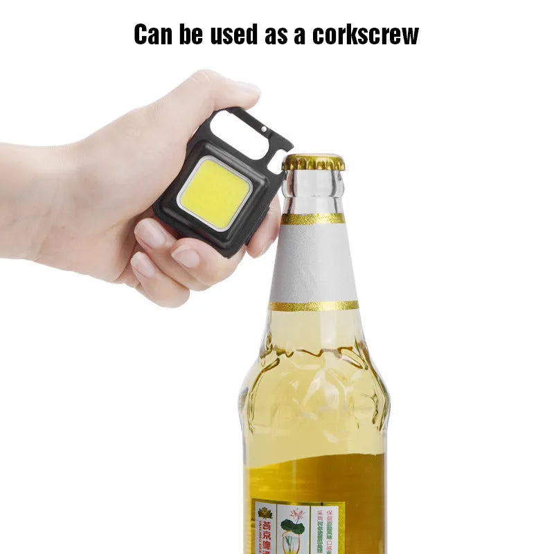 Black aluminium alloy USB rechargeable keychain flashlight with magnetic base and folded swivel handle