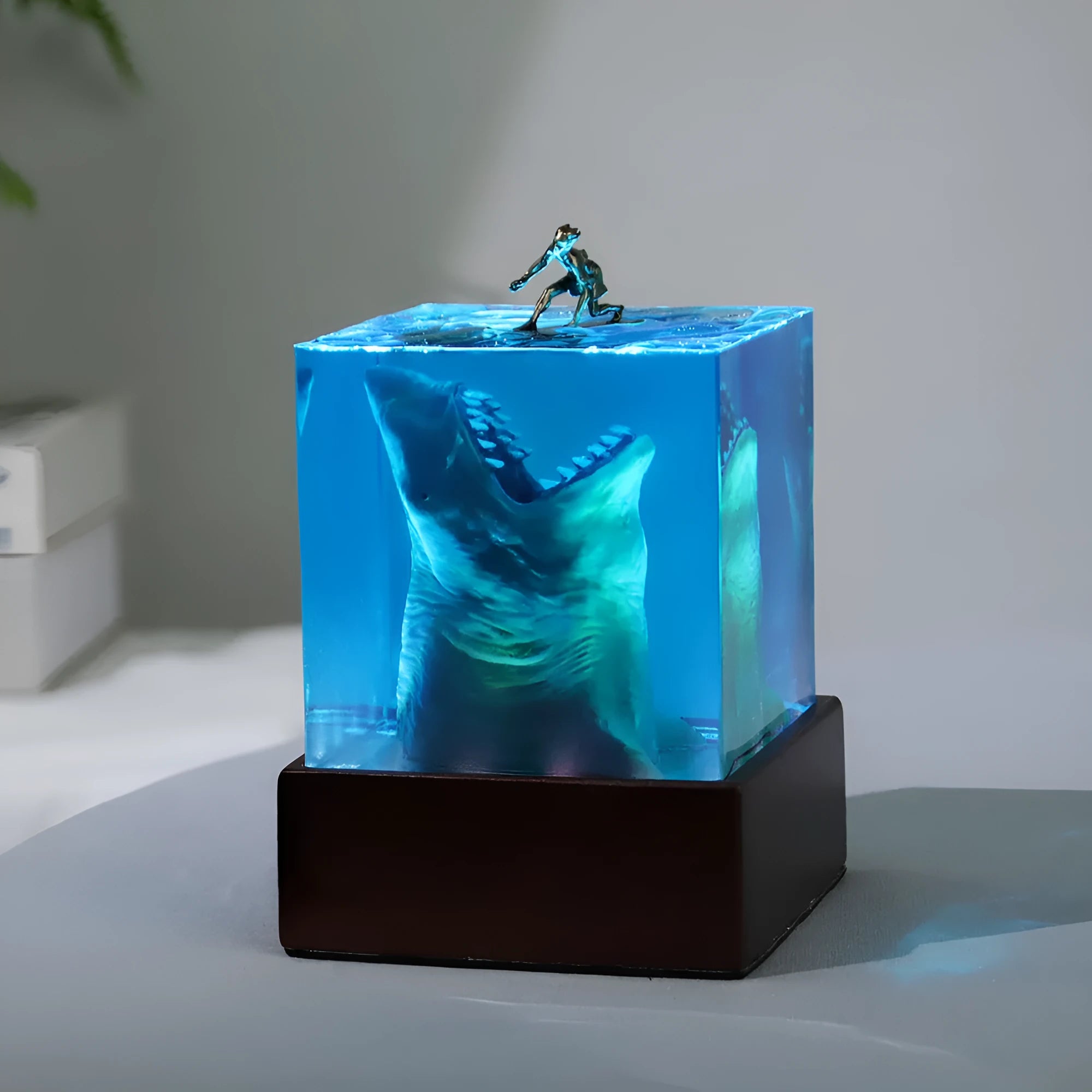 Crystal clear epoxy resin shark surfing night light ornament in modern minimalist style