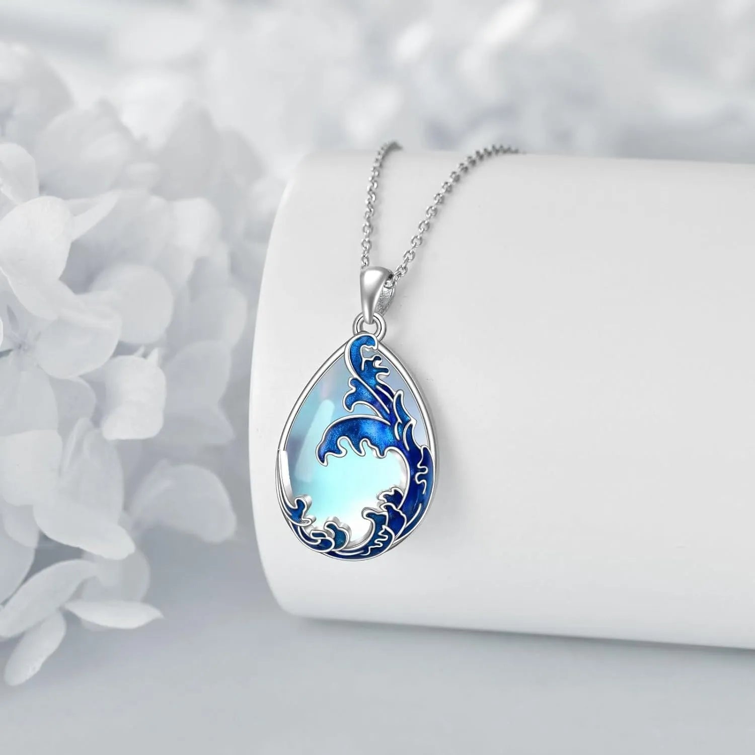 Blue heart-shaped alloy pendant on a necklace chain.