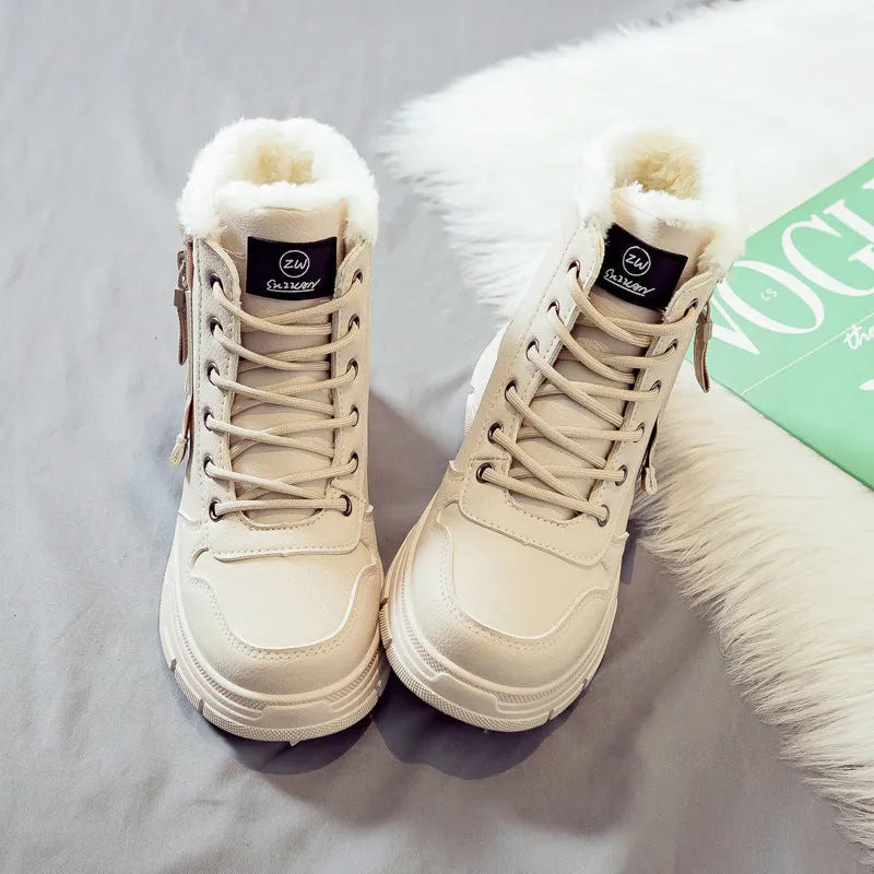 Plus size women's snow boots in black with fleece lining and lace-up front