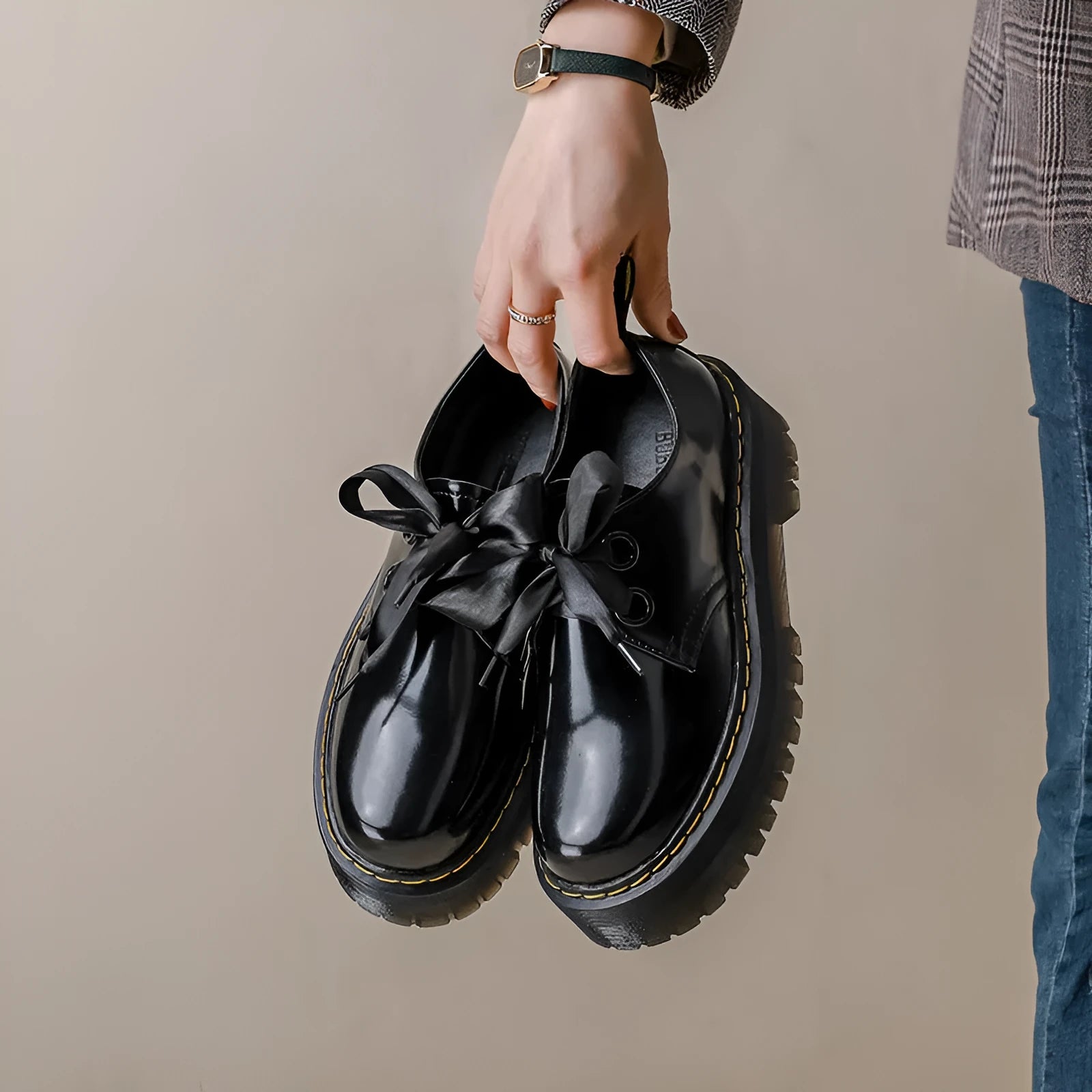Women's thick-soled leather shoes with lace-up closure and decorative ribbon detailing
