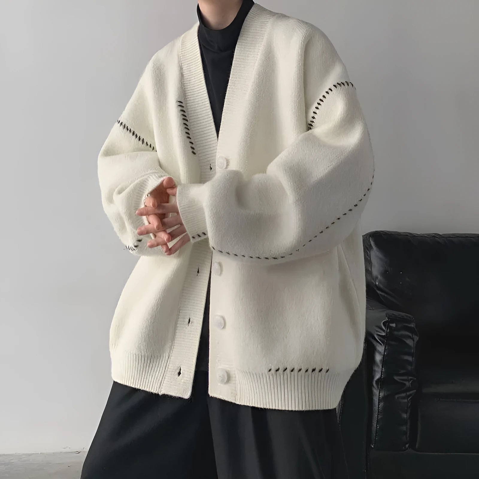 Women's polyester knitted cardigan coat in black or white with long sleeves