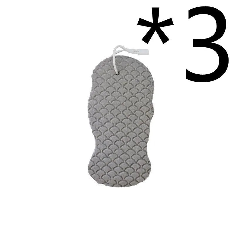 White 3D fish scale pattern bath sponge ball with hanging loop on a grey background.