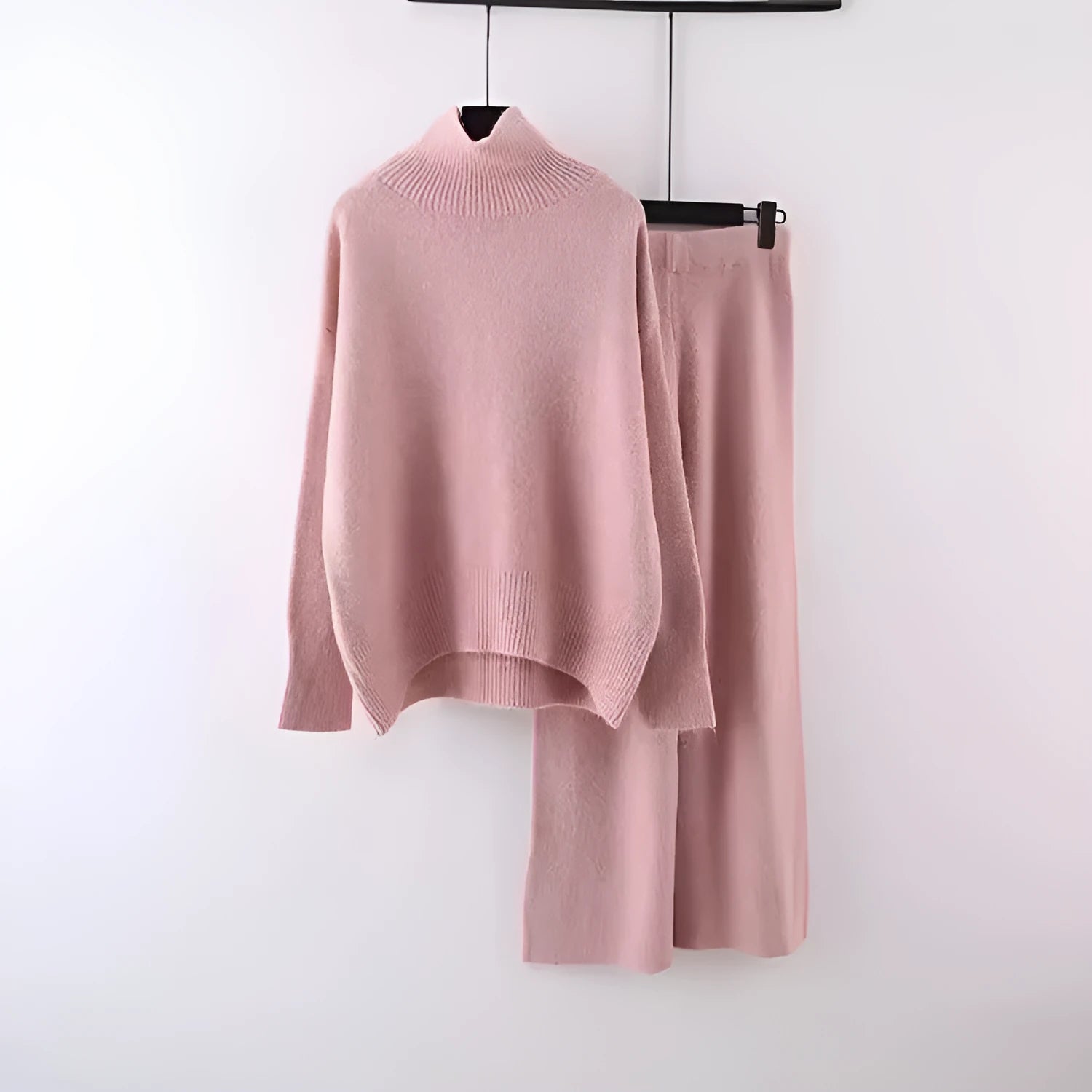 Women's beige acrylic sweater and wide-leg trousers two-piece set on a hanger