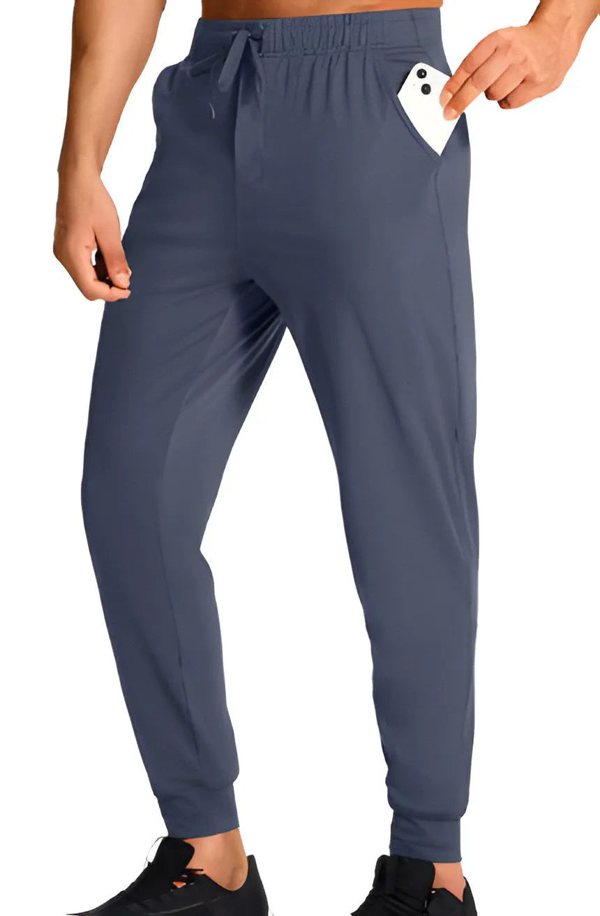 Men's loose fit polyester casual trousers in solid colour with relaxed silhouette