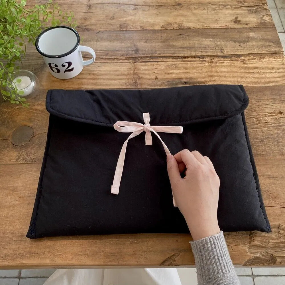 Women's quilted computer bag with ballet-style bow and striped pattern in black or white for 11-inch or 13-14-inch laptops