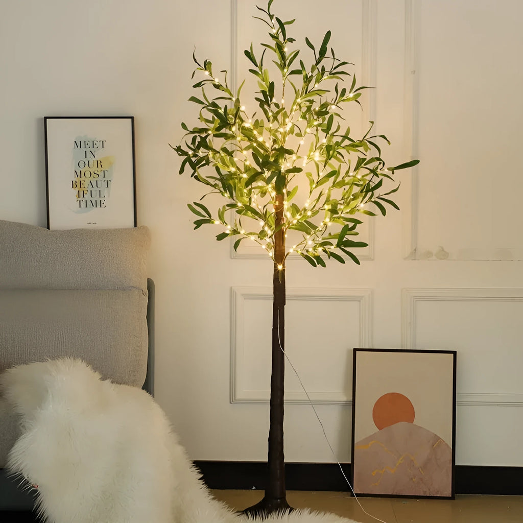 1.8 metre tall artificial olive leaf tree lamp with warm white LED lights illuminated in garden setting