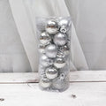 Assorted gold, red, silver, and blue plastic electroplated Christmas baubles in 3cm and 6cm sizes.