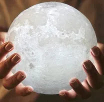3D printed moon light lamp on wooden stand with detailed lunar surface, showing touch ring at base.