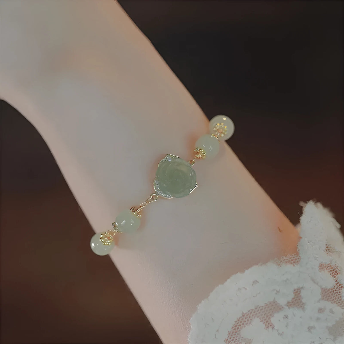 Women's bracelet with Hetian jade rose flower pendant on gold chain