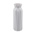 Simple green melamine plastic vase with a wide 7.2 cm base on a wooden table.