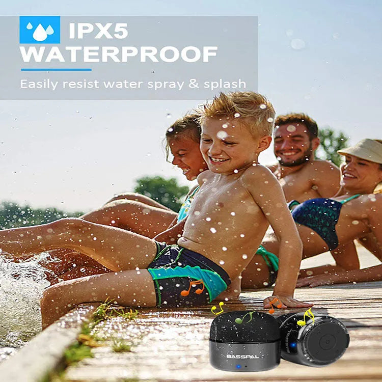 Black waterproof portable mini Bluetooth speaker with buttons for radio and call functions