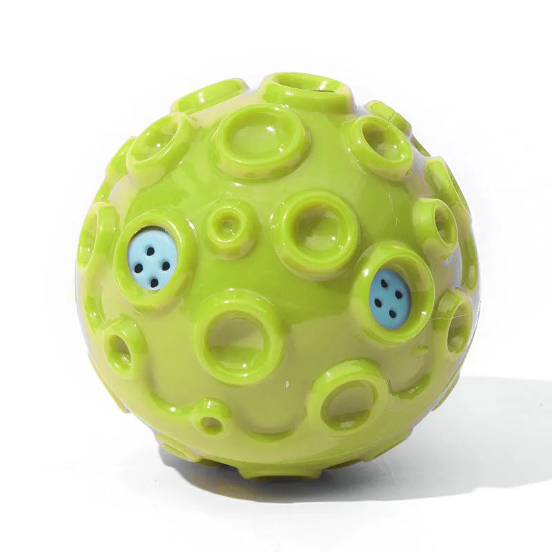 Colourful natural rubber dog chew ball with textured surface and meteorite-shaped bumps