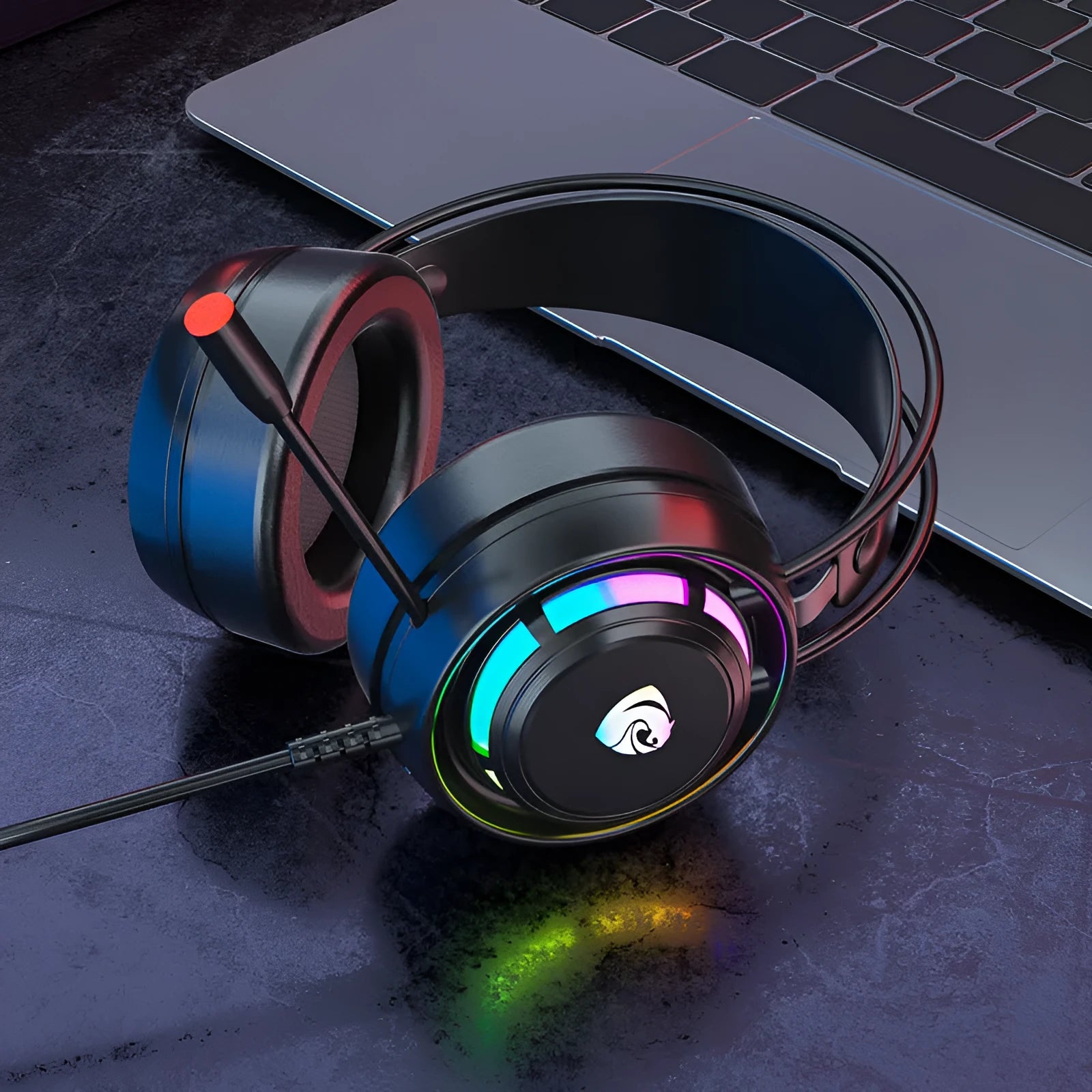 Black computer gaming headset with microphone, sponge ear cushions, and long cable showing 3.5mm and USB plug options
