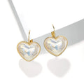 A pair of gold-coloured women's ear clips with a natural design on a white background.
