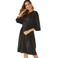 Loose elastic belt cinched short dress in solid black or red with long sleeves and A-line skirt
